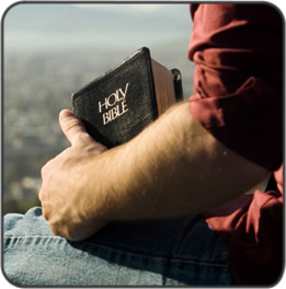 A man holding a Bible